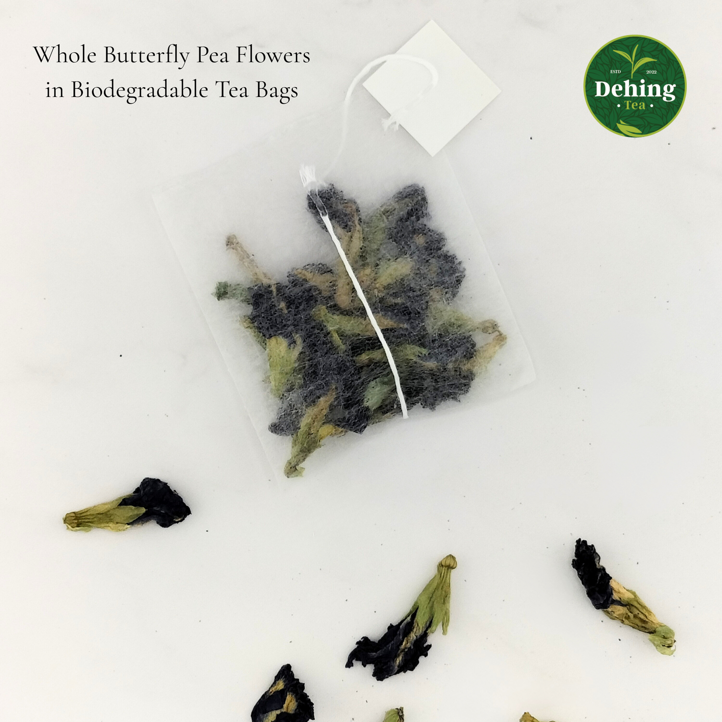 Blue tea or Butterfly pea flower tea bags on a white background with 'Dehing Tea' branding.