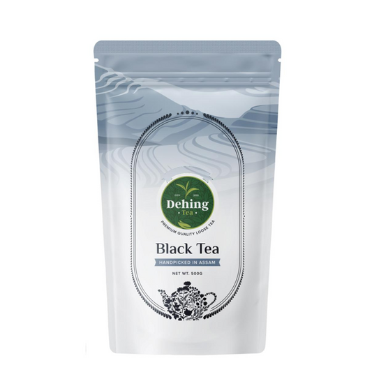 A packaged bag of Dehing Assam Black Tea with a label showing the brand logo, product name, and a brief description.