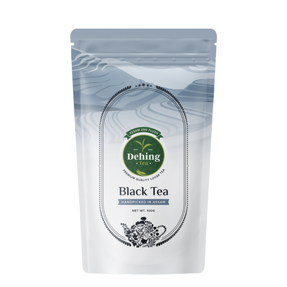 Packaging of Dehing Assam Black Tea 2nd Flush, featuring a predominantly white bag with black and silver accents, branding, and text indicating the product as 'Black Tea' and '2nd Flush'.